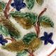 Old barbotine dessert plate. Floral patterns