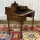 Louis XVI style desk from the late 19th century in walnut with a leather top.
