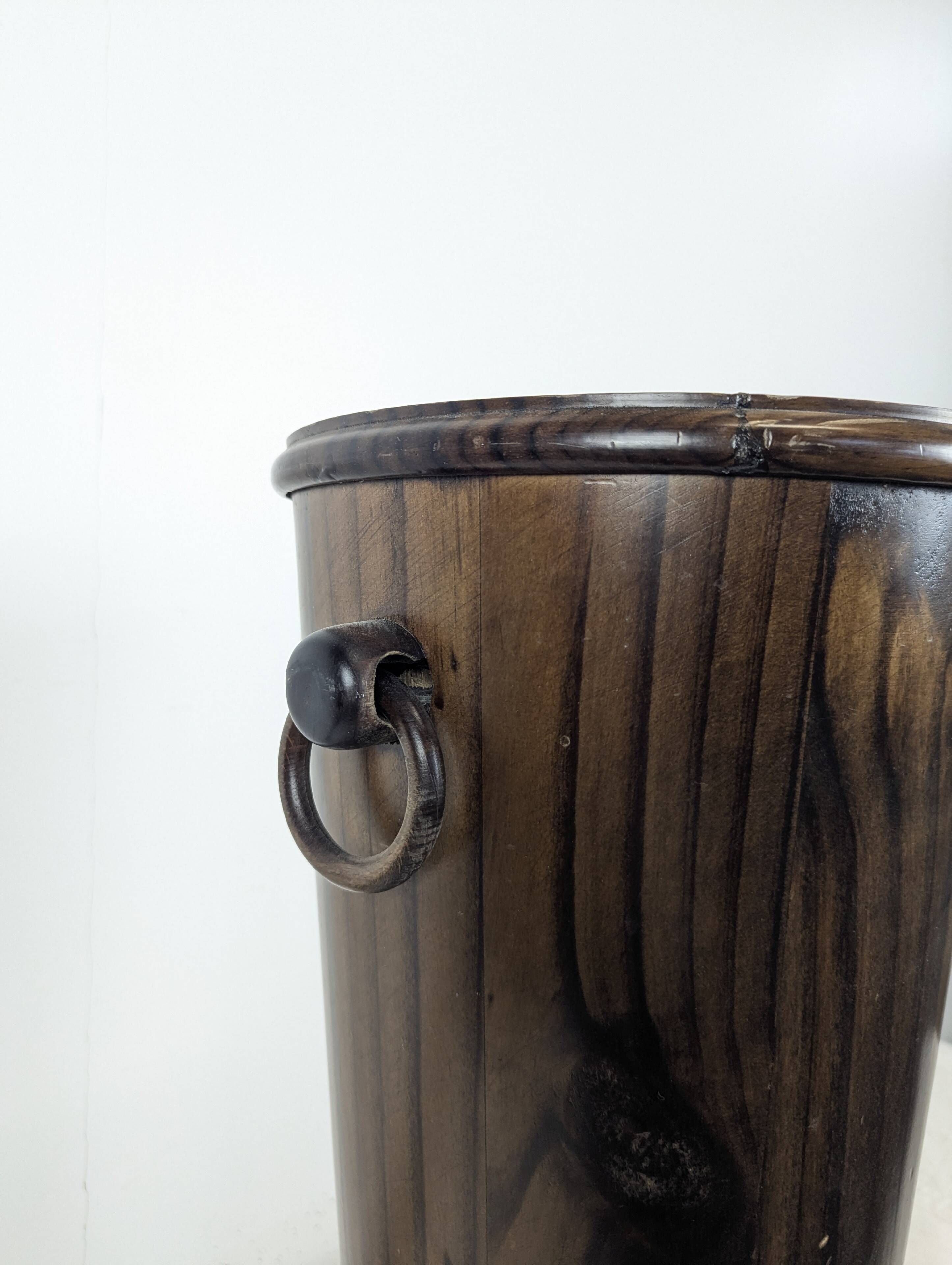 Wooden umbrella stand turned and patinated with iron rings