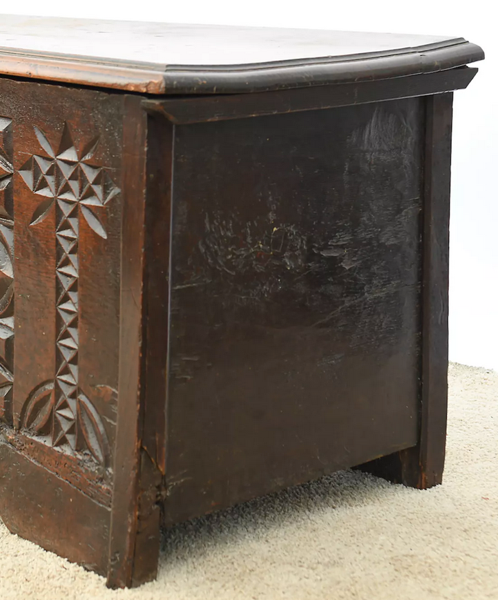 Antique chest in carved wood