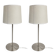 Pair of large brushed metal lamps with cream shades.