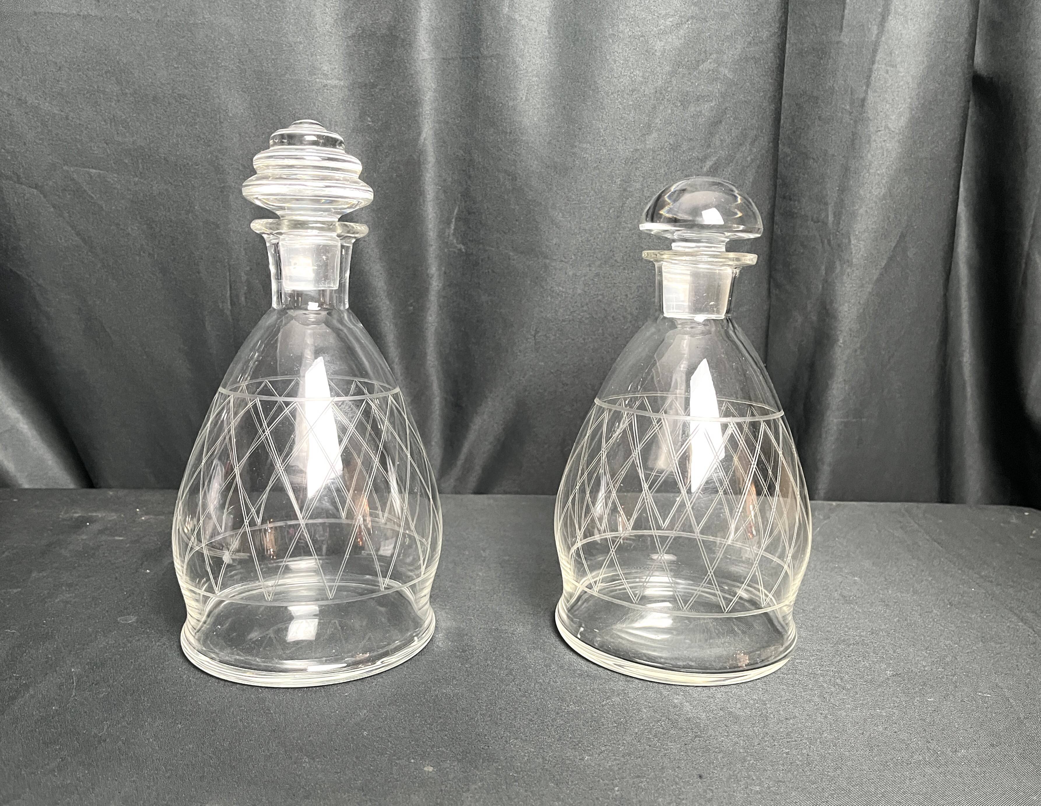 Tableware, two engraved crystal carafes with stoppers from around 1940.