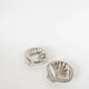 Pair of shell-shaped stainless steel catchalls, design, 1970