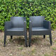 2 black Toy chairs designed by Starck