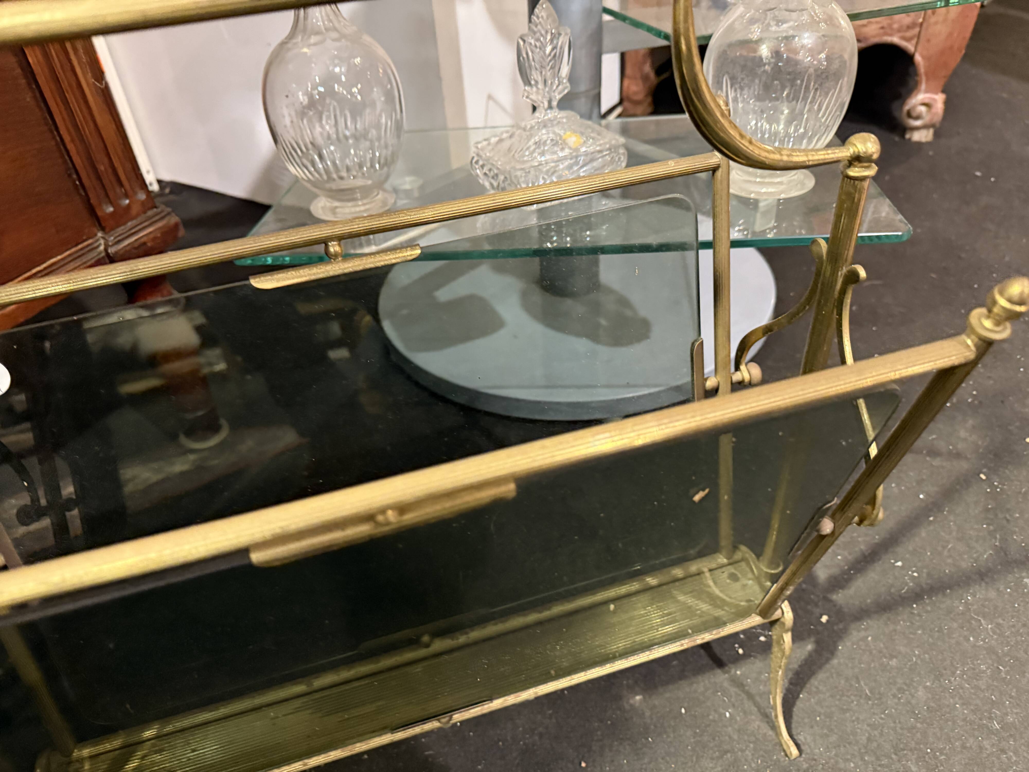 Tinted glass and brass magazine rack