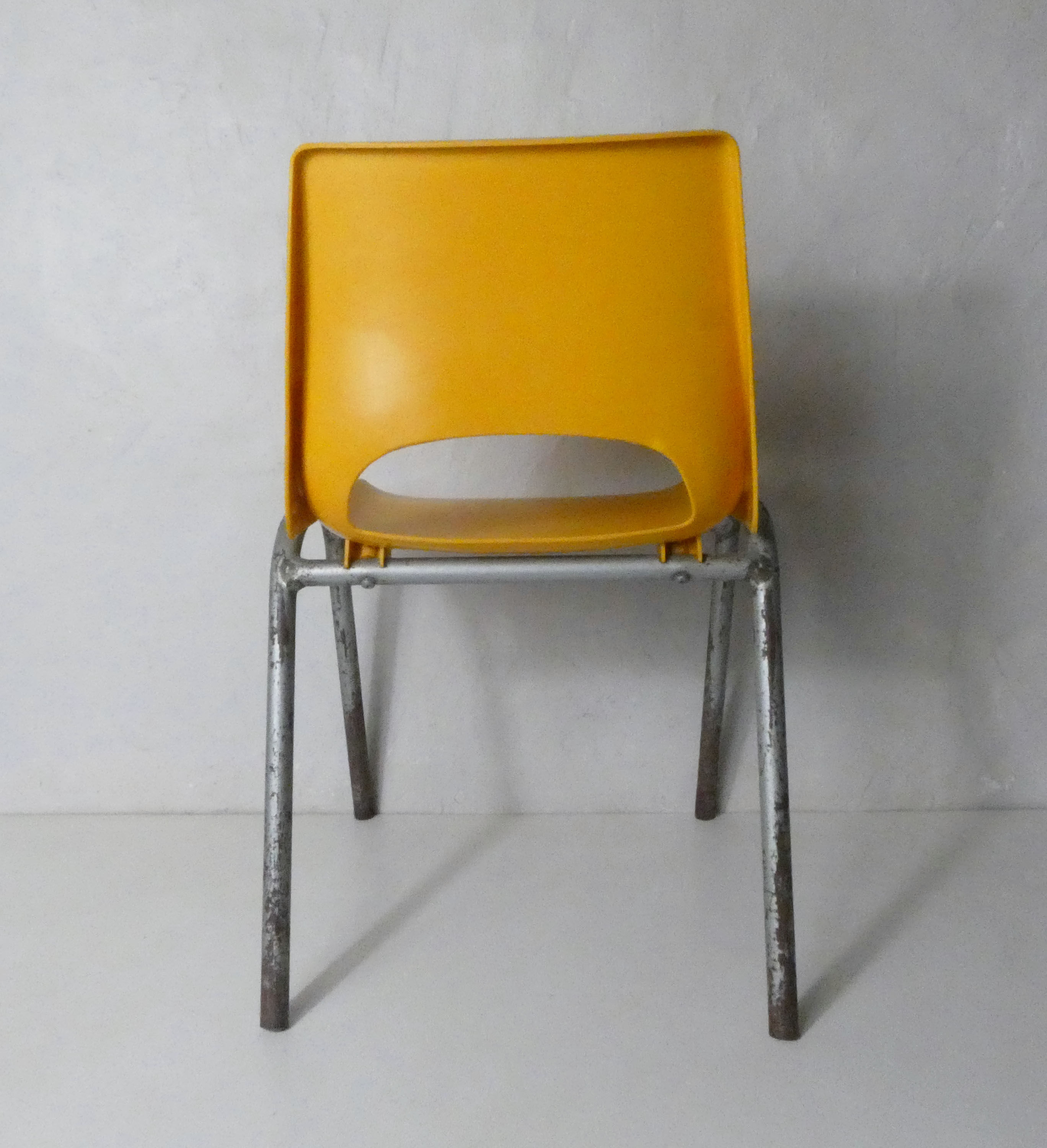 yellow plastic child chair