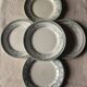 A set of 5 mismatched green blue Terre de fer flat plates