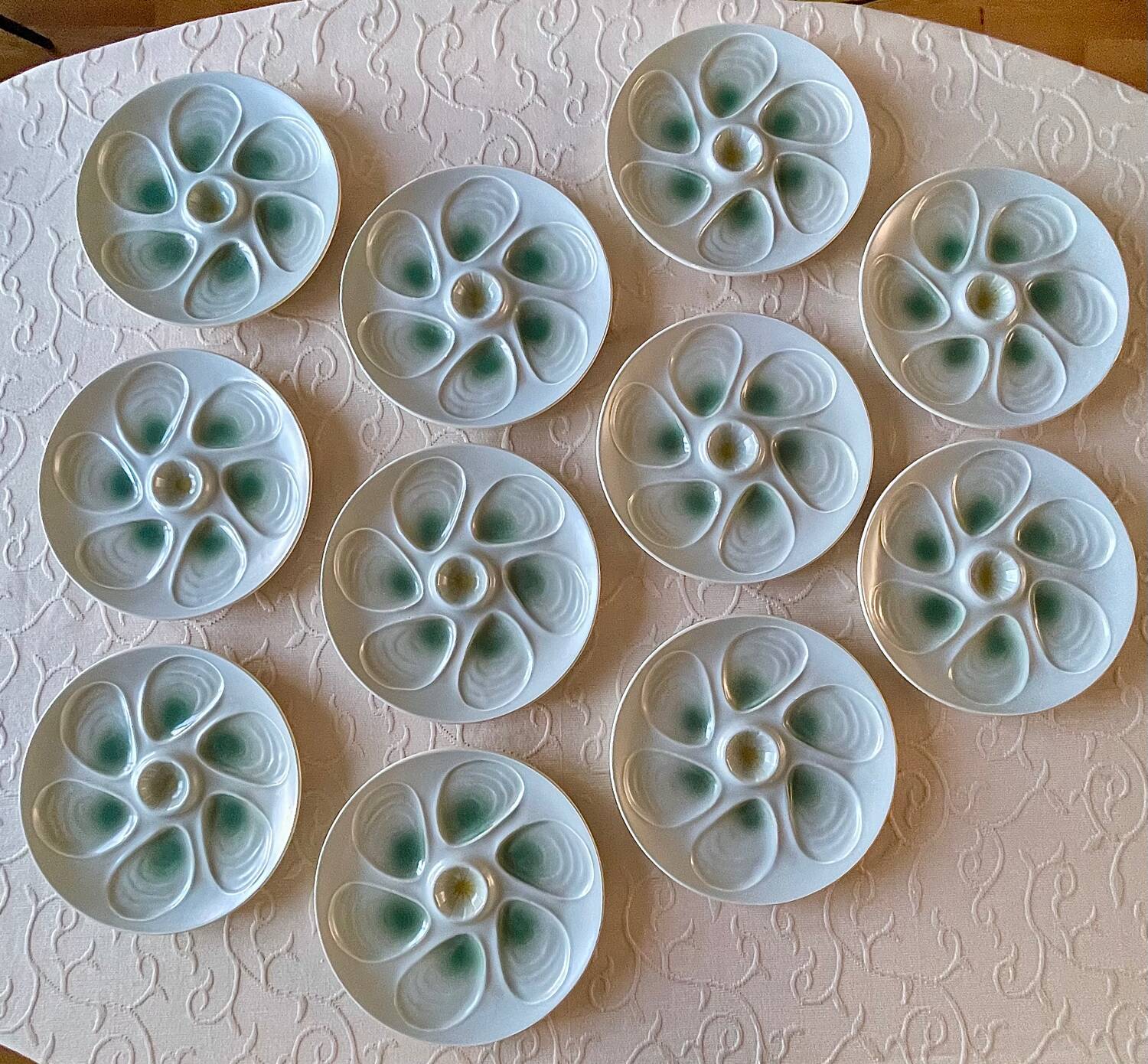11 oyster plates 1960.