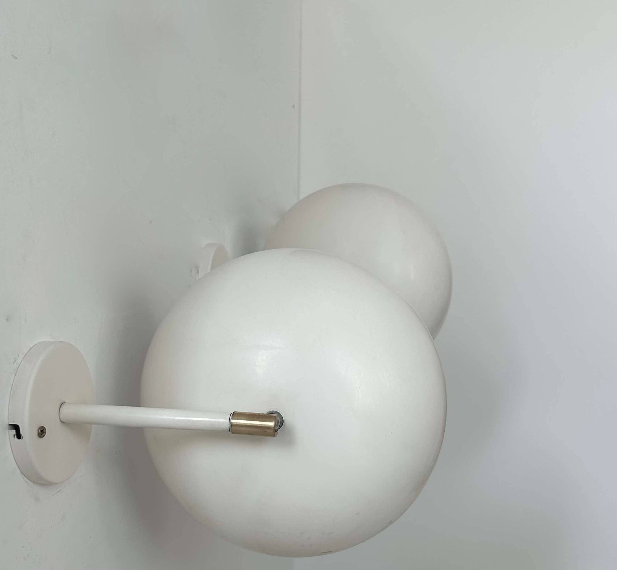 Pair of vintage adjustable wall lights, brass and white metal, France 1970