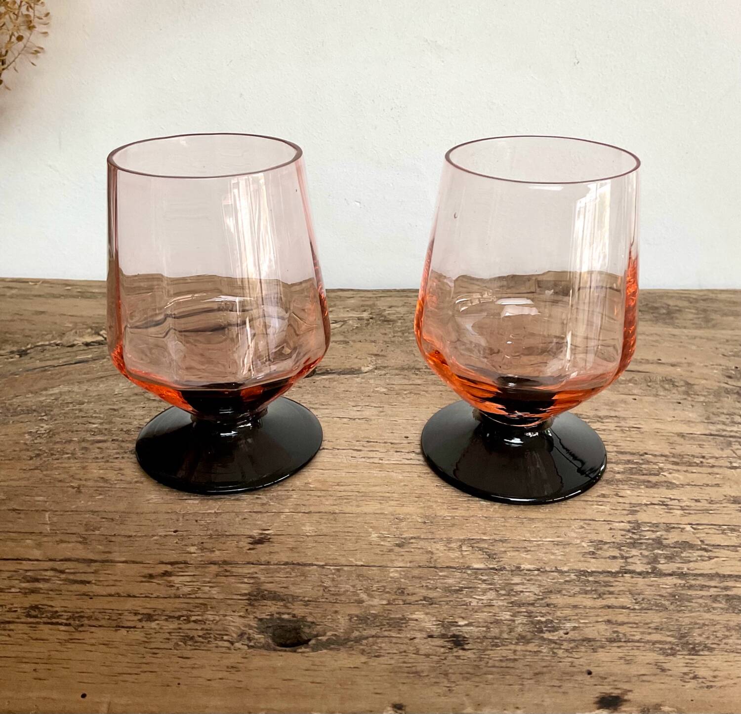 6 small pink glasses with black stem