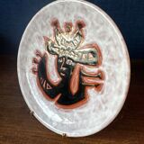 Terracotta plate, Jean Lurçat decorated with a character on a white background.
