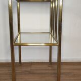 Bedside table in brass and glass.