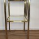 Bedside table in brass and glass.