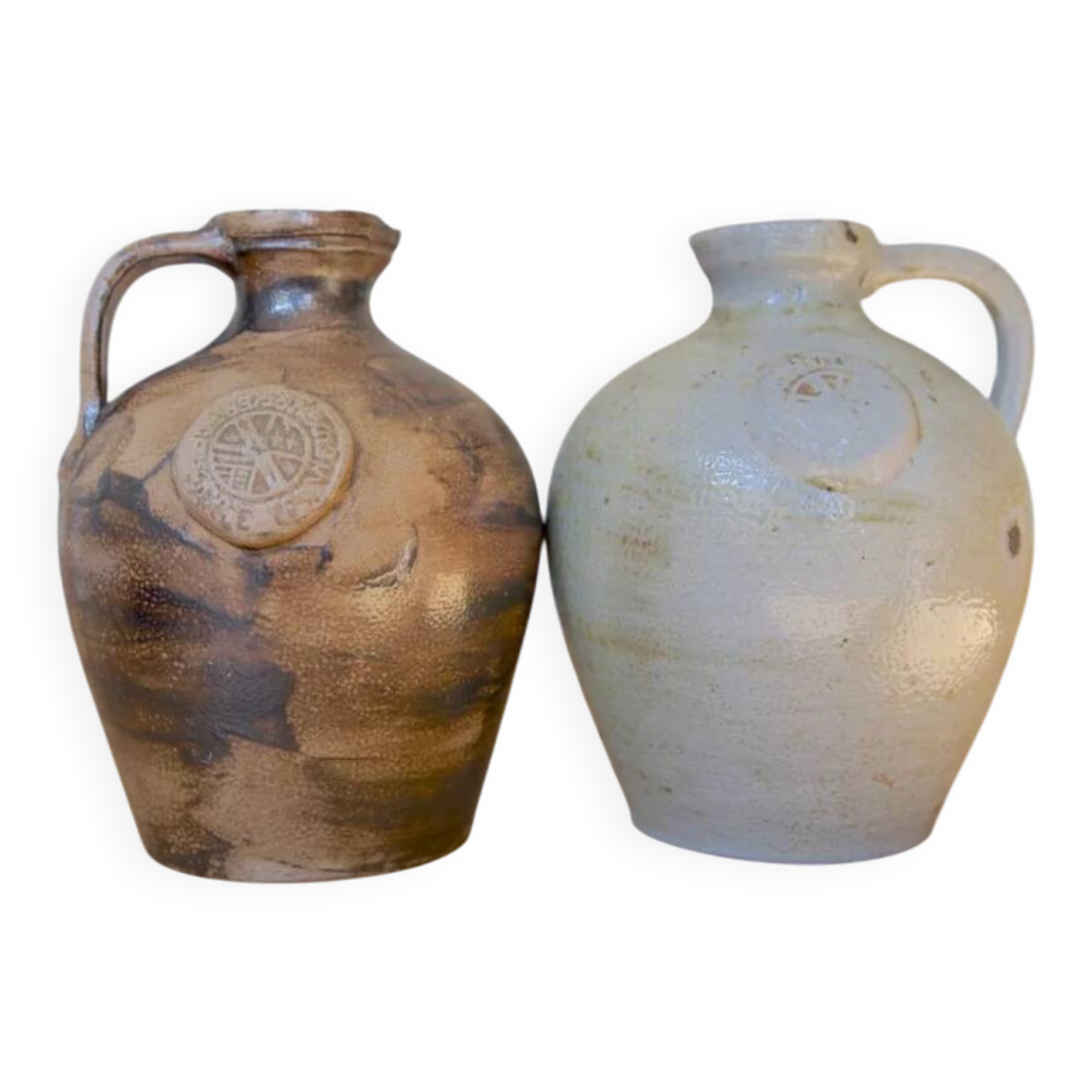 Duo of brown and cream ceramic jugs