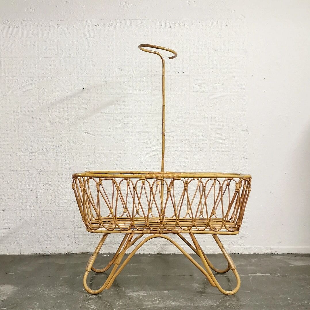 Baby cradle in vintage rattan