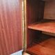 Dark wood sideboard with brass finishes and compass feet