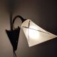 1950s wall lamp, metal, flexible brass stem and opaque shade.