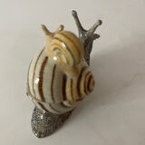 Porcelain figurine snail and its small