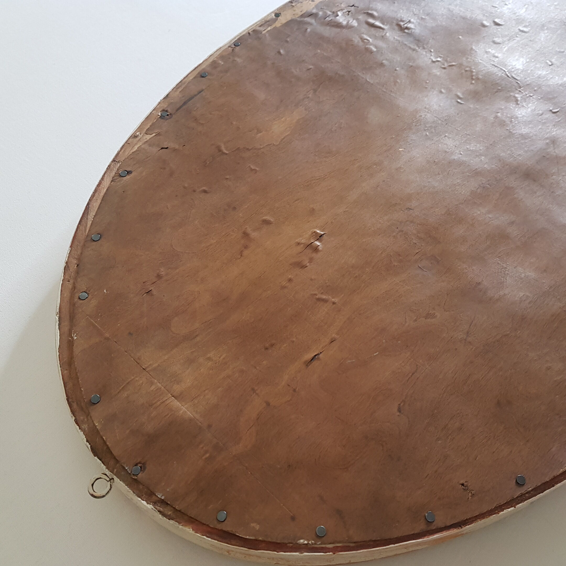 Large oval mirror with bevelled ice in stucque and wood decorated with flowers