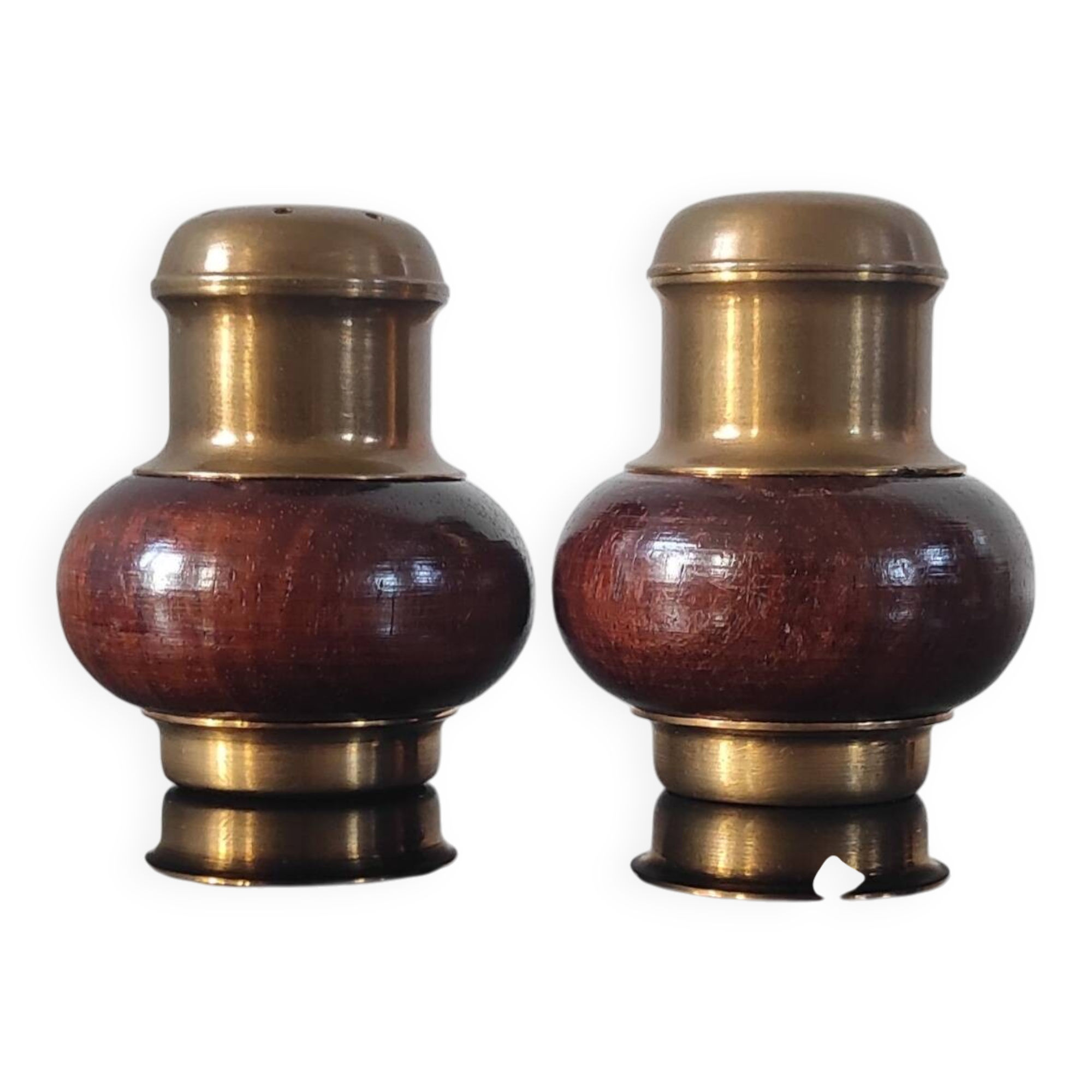 Vintage salt and pepper shaker duo in brass and turned wood.