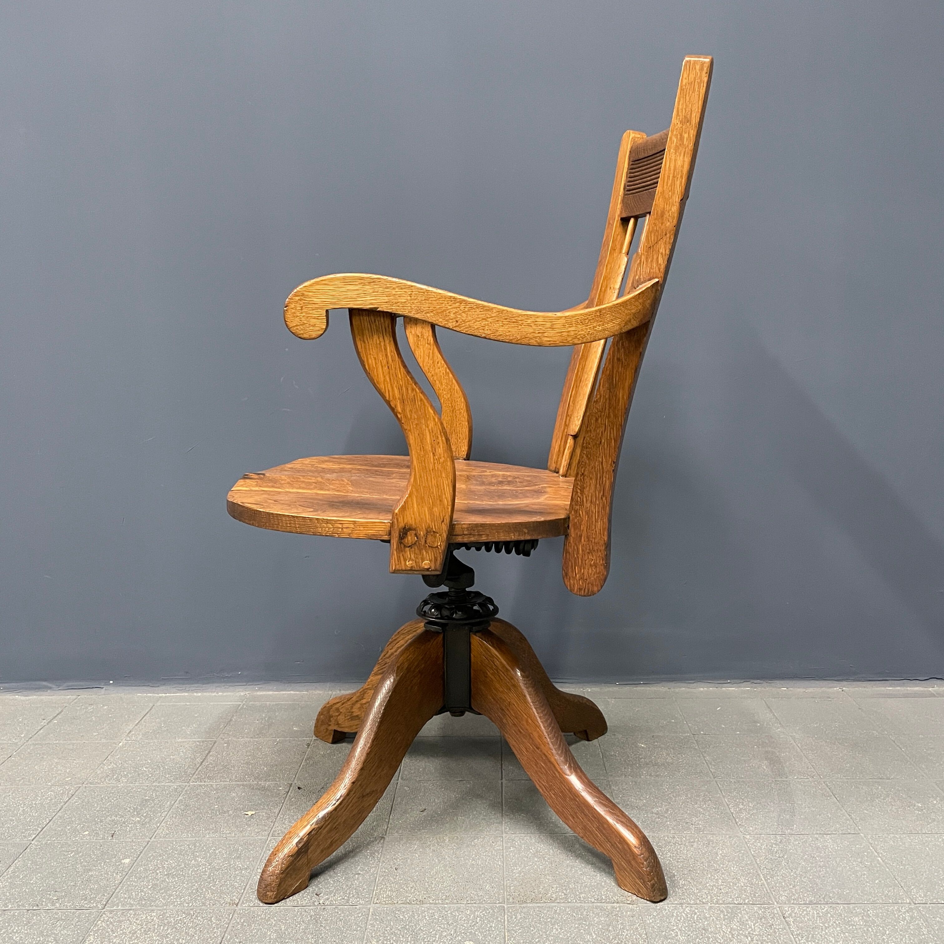 Antique American oak office chair with armrests 1920s