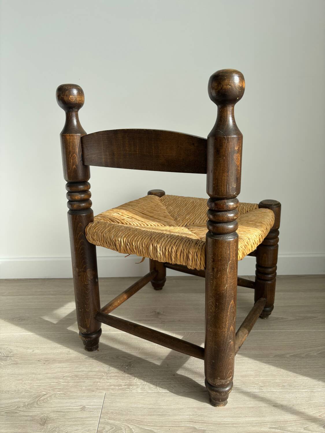 Vintage low chair in the style of Charles Dudouyt – Wooden fireside chair