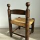 Chaise basse, de cheminée vintage style Charles Dudouyt en bois et paille