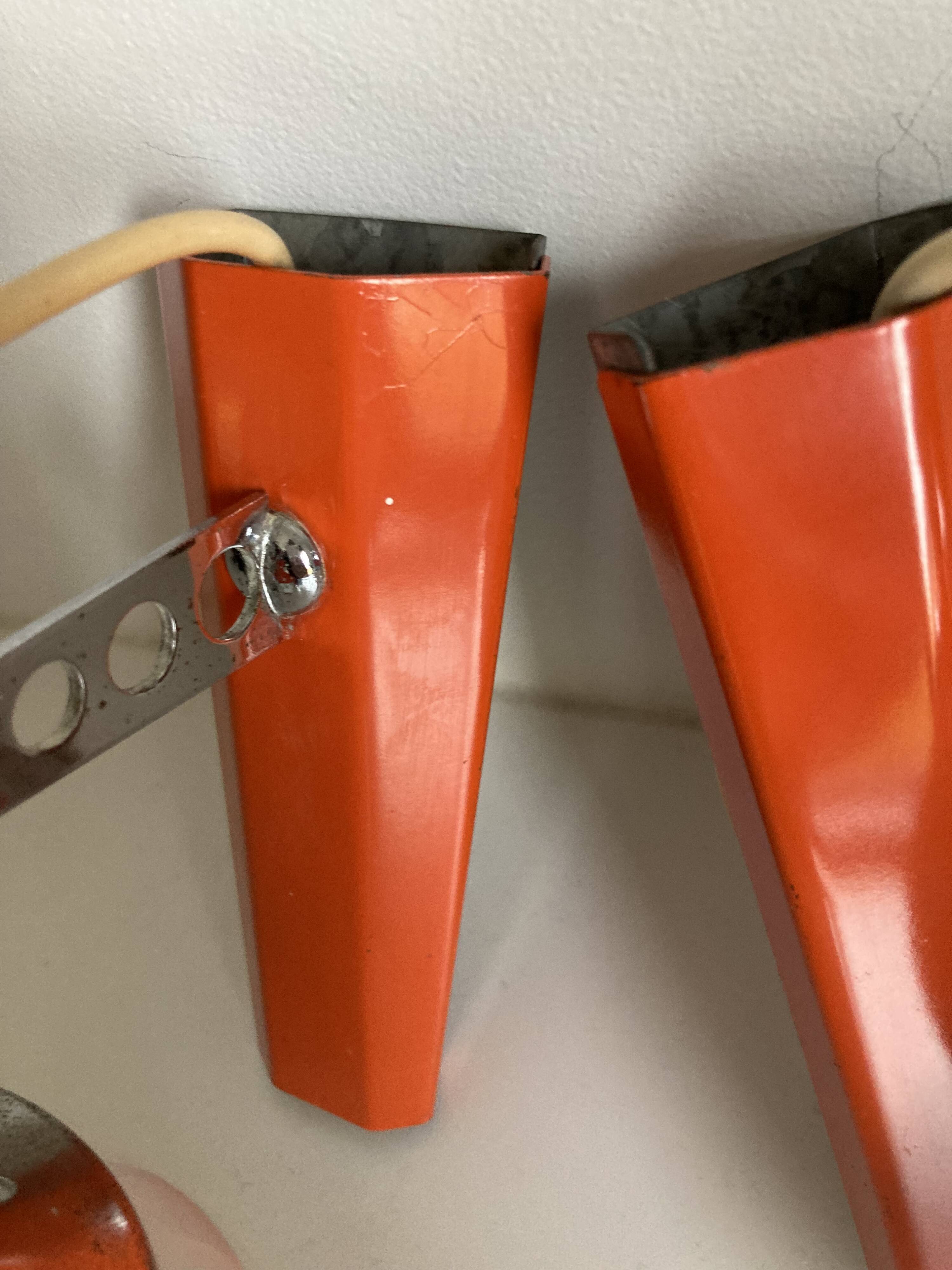 Set of two vintage orange wall lights from the 70s