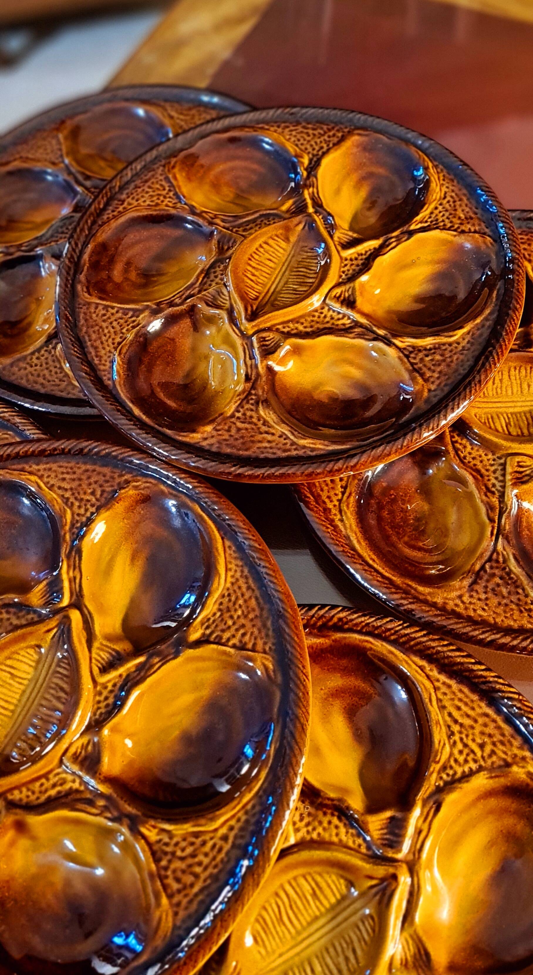 Six oyster plates signed Saint Clément