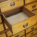 School cabinet bank of vintage Dutch drawers in mid-twentieth century pine