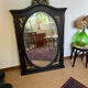 Large old trumeau mirror in black and gilded wood Napoleon style