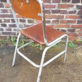 Chaise vintage datée 1955 assise en cuir