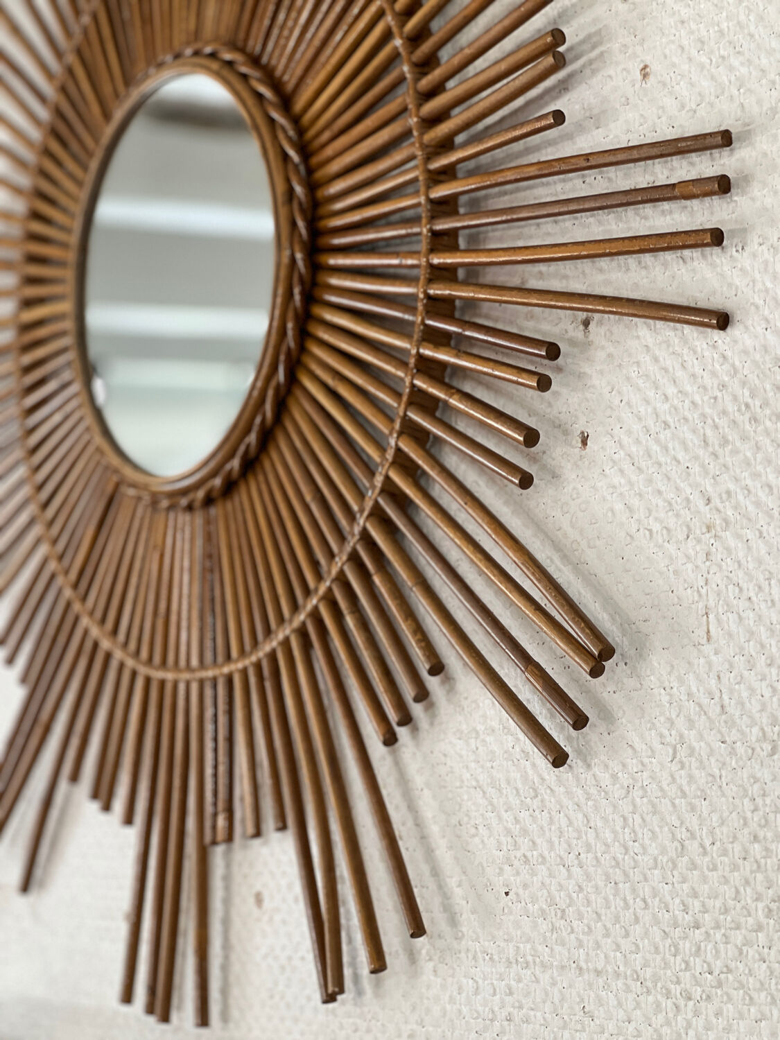 Large sun mirror in rattan