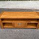 Solid pine wood TV unit stained with drawer and storage.