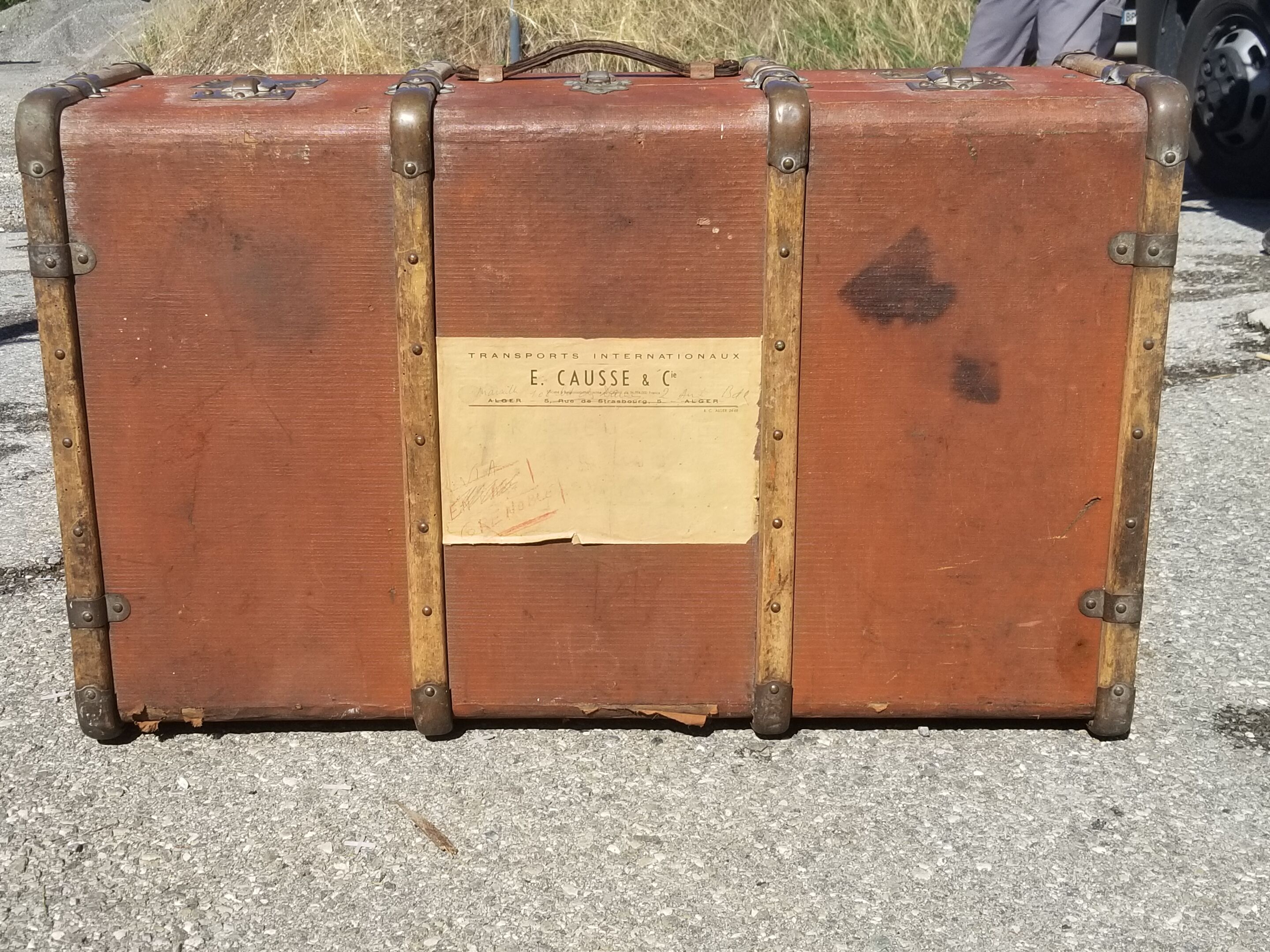 Old travel trunk made of wood and brass
