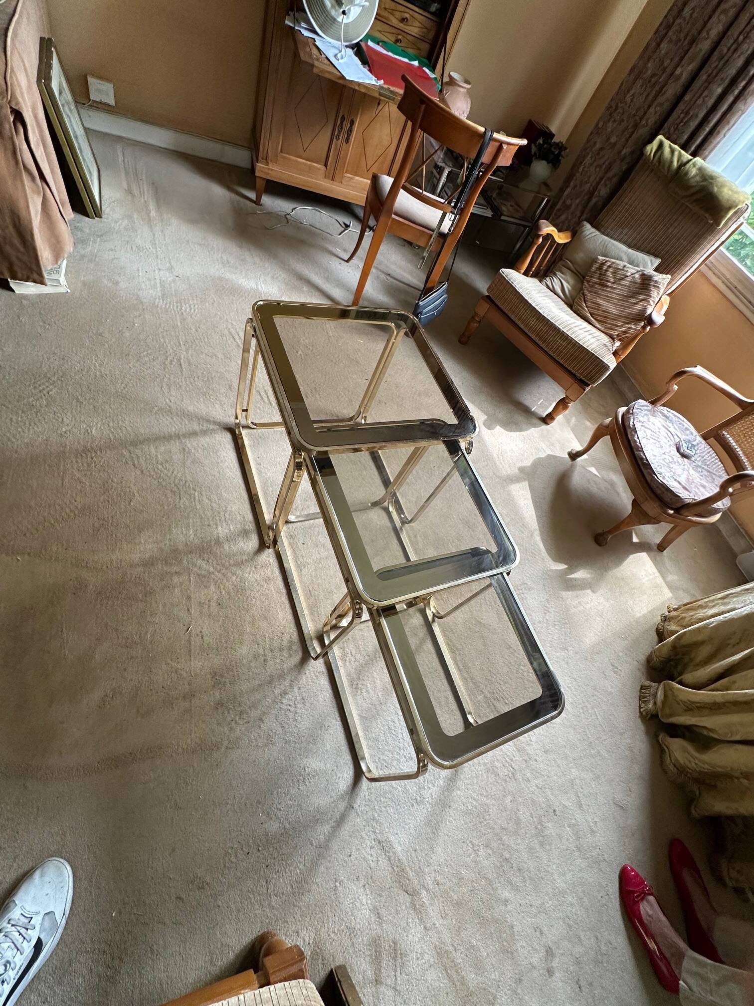 Brass nesting tables with smoked glass tops