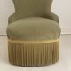 Small green velvet tub chair