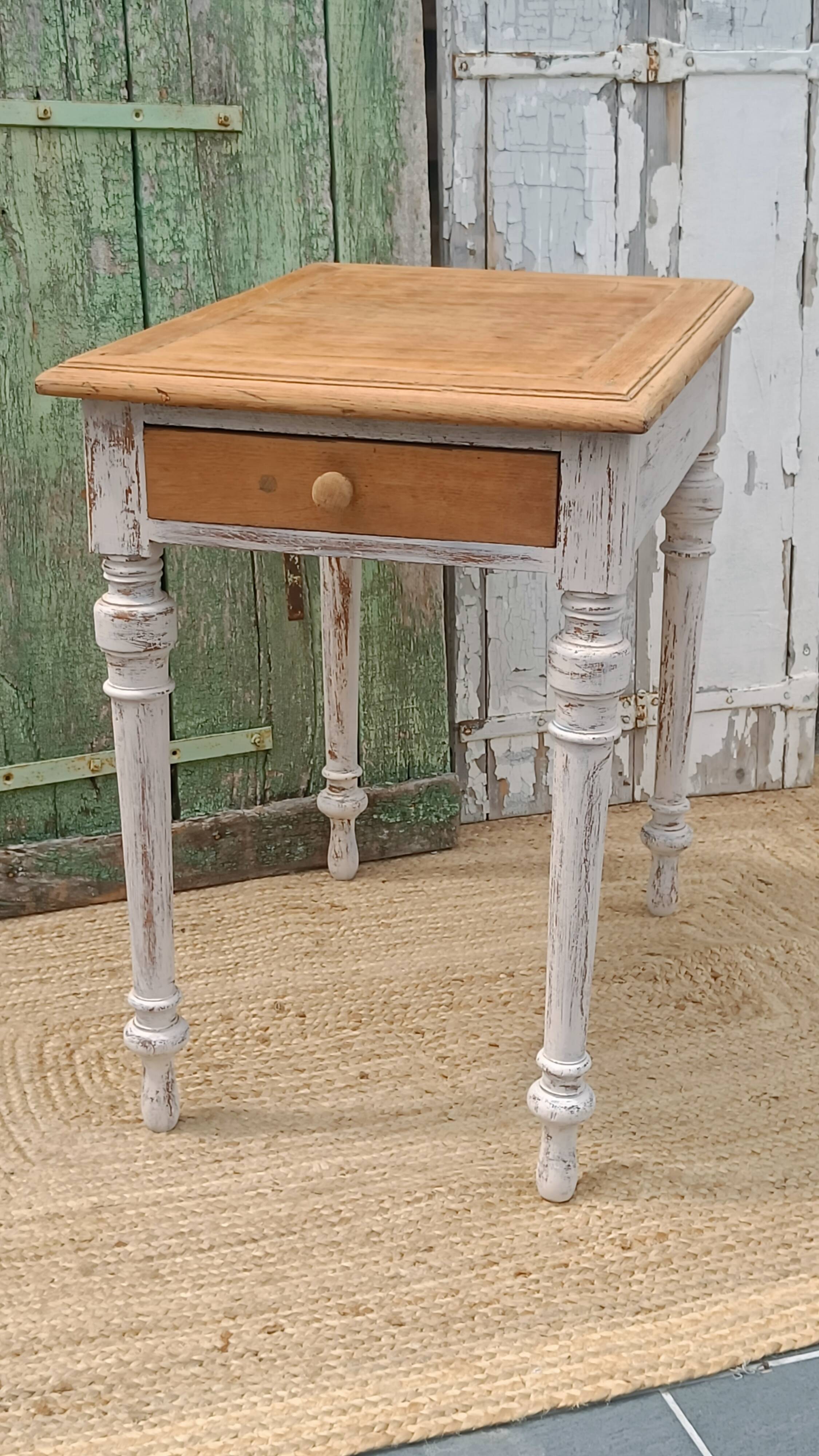 Antique drawer table with a patina.