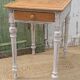 Antique drawer table with a patina.