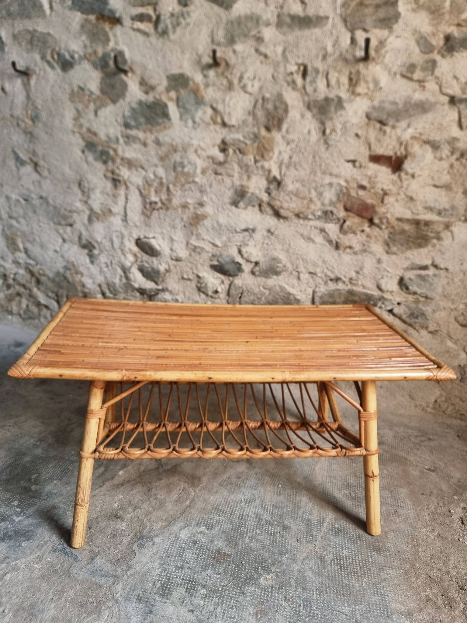 Vintage bamboo and rattan coffee table with magazine rack, French, circa 1960–1970.
