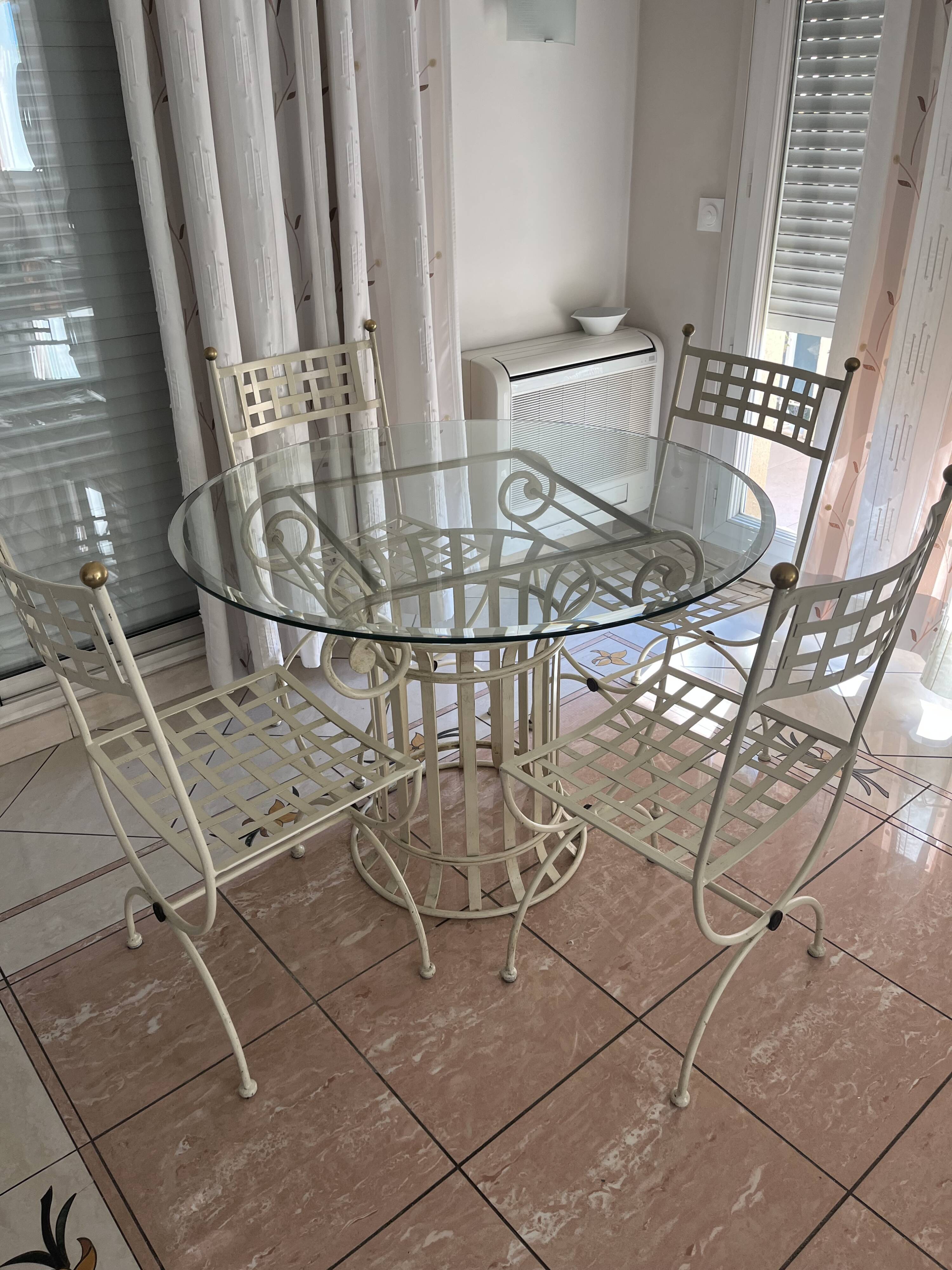 Wrought iron round table and 4 chairs