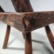Rustic Wabi-Sabi style accent chair in dark curved hardwood, 1900s.