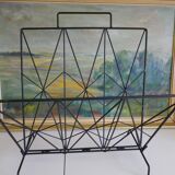 Magazines rack with very fine black metal geometric