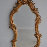 Miroir en stuc doré rocaille époque XIXème 110cm