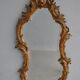 Miroir en stuc doré rocaille époque XIXème 110cm