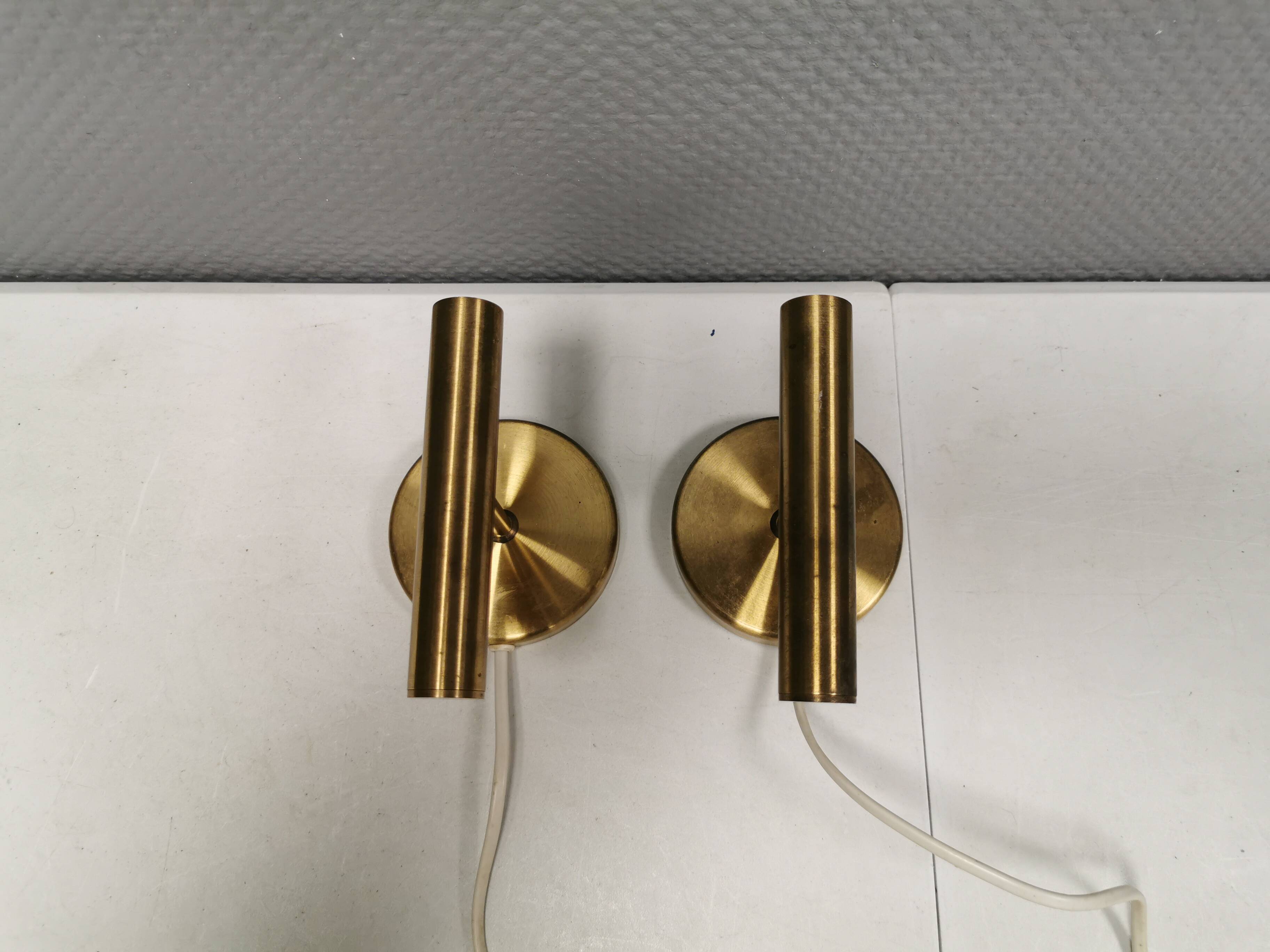 A set of stylish brass wall lamps from Danish Darø
