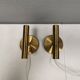 A set of stylish brass wall lamps from Danish Darø
