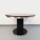 Vintage dining table in melamine with a black wood effect and chrome metal.