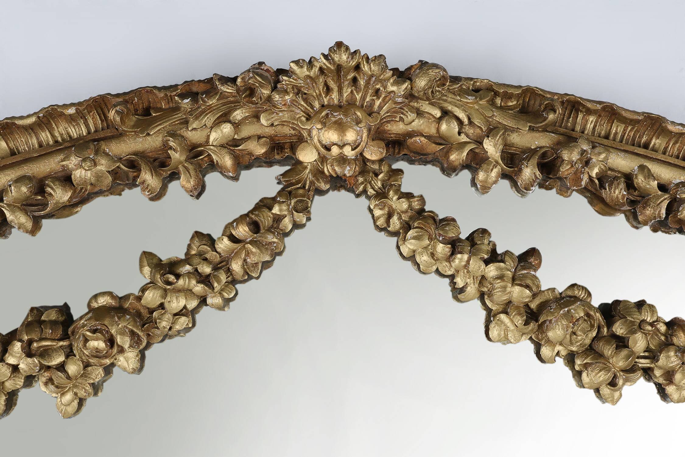 Large baroque decorated chimney mirror in gilted wood, France ca. 1800