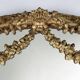 Large baroque decorated chimney mirror in gilted wood, France ca. 1800